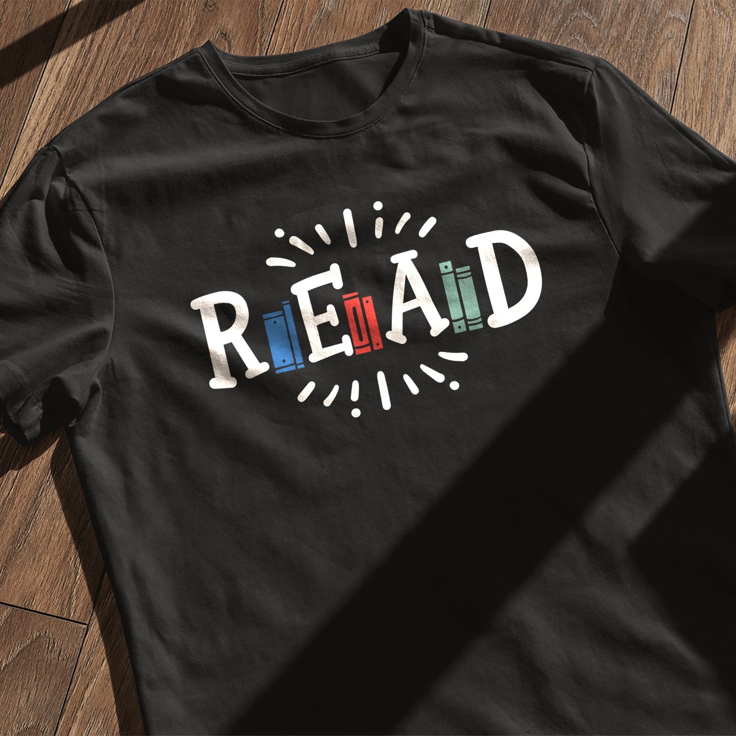 Read Between the Laughs T-Shirt