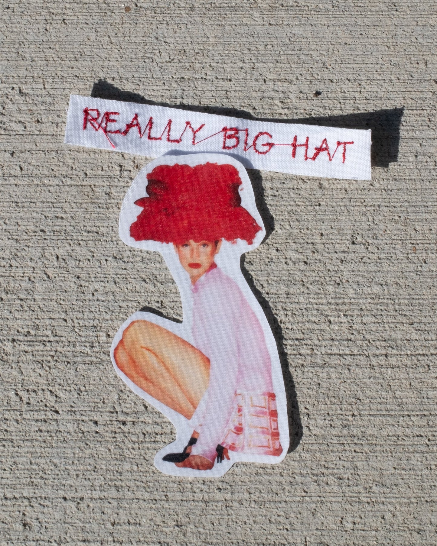 really big hat baby tee
